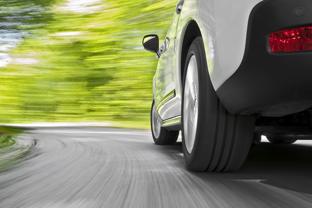 White car driving on road. Photo ID 26141697 © Supergenijalac | Dreamstime.com